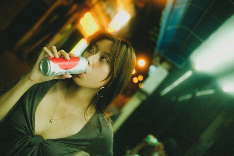 Woman Drinking From A Can