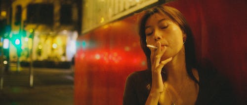 Free Photo of a Woman Smoking Cigarette Stock Photo