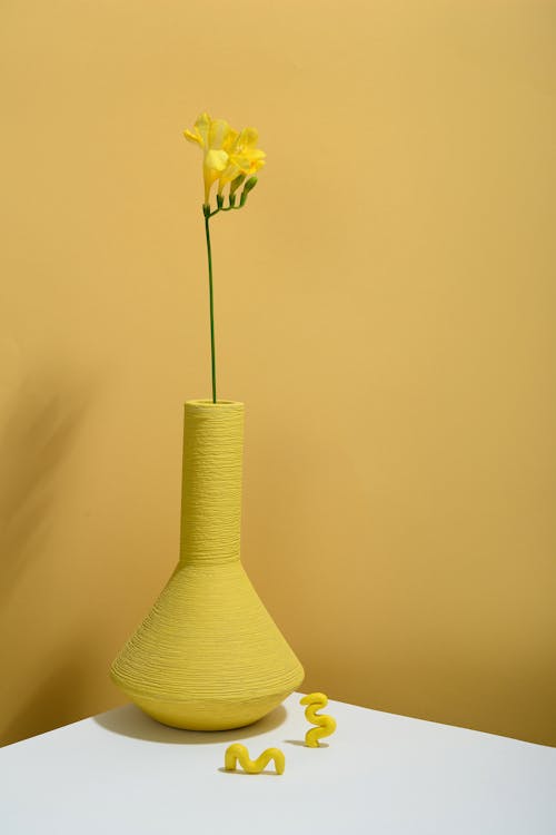 Photo of Bell Flower on Yellow Vase