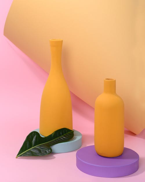 Free Photo of Green Leaf Beside Yellow Vase Stock Photo