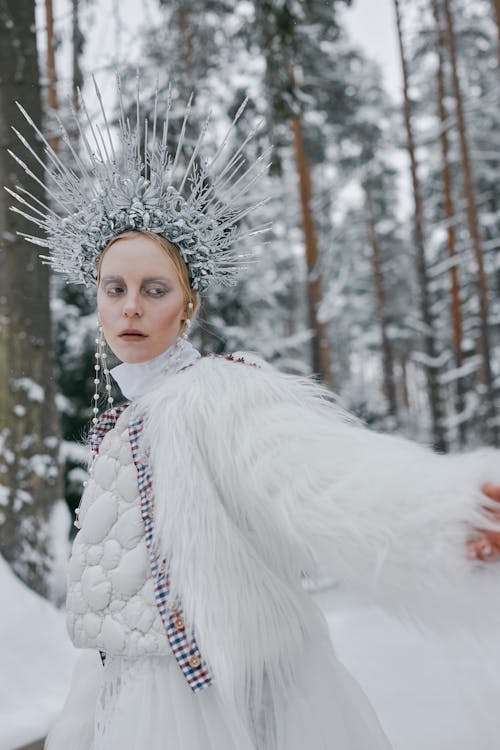 Free A Woman in White Fur Coat and a Crown Stock Photo