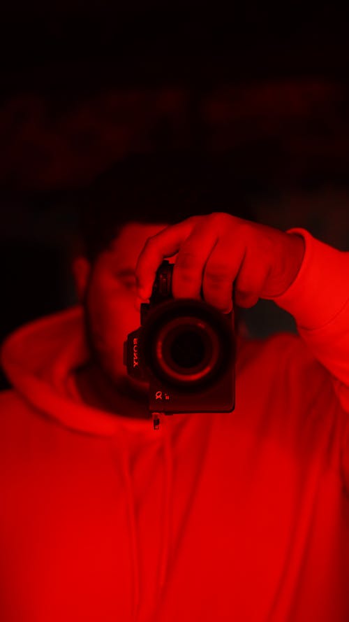 Free Person Holding Black Dslr Camera Stock Photo