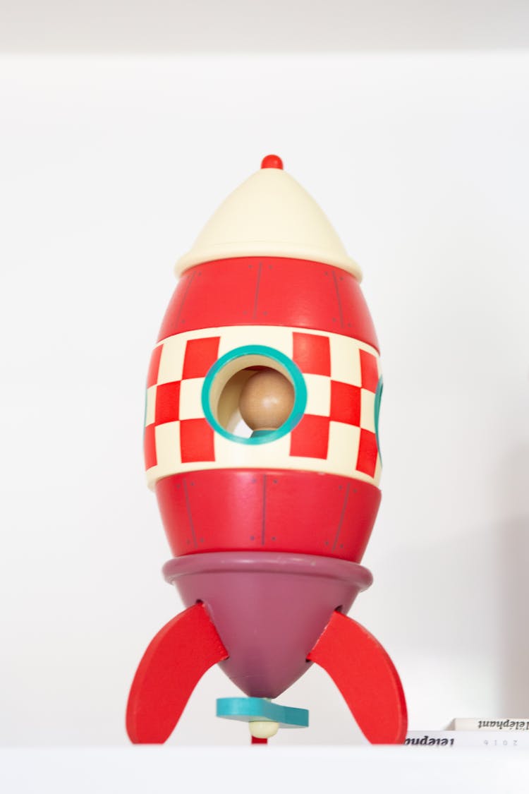 Wooden Toy Rocket On White Background