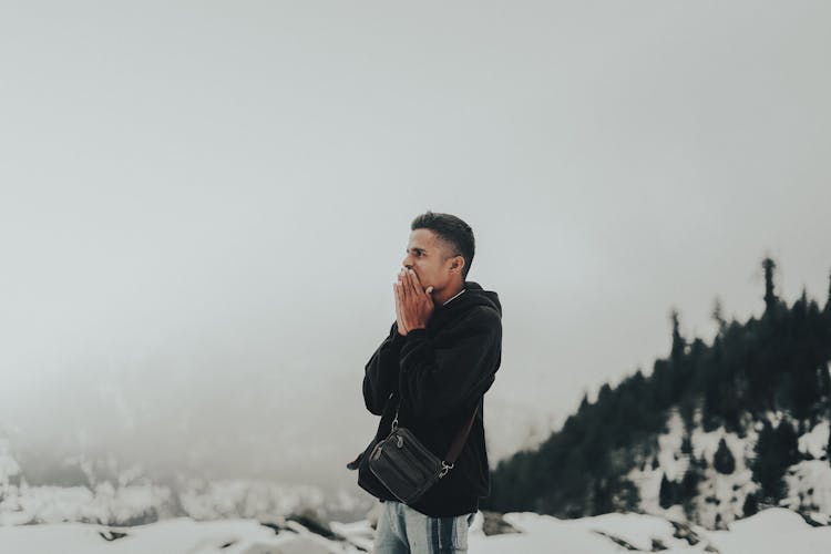 Man In Awe Among Winter Landscape