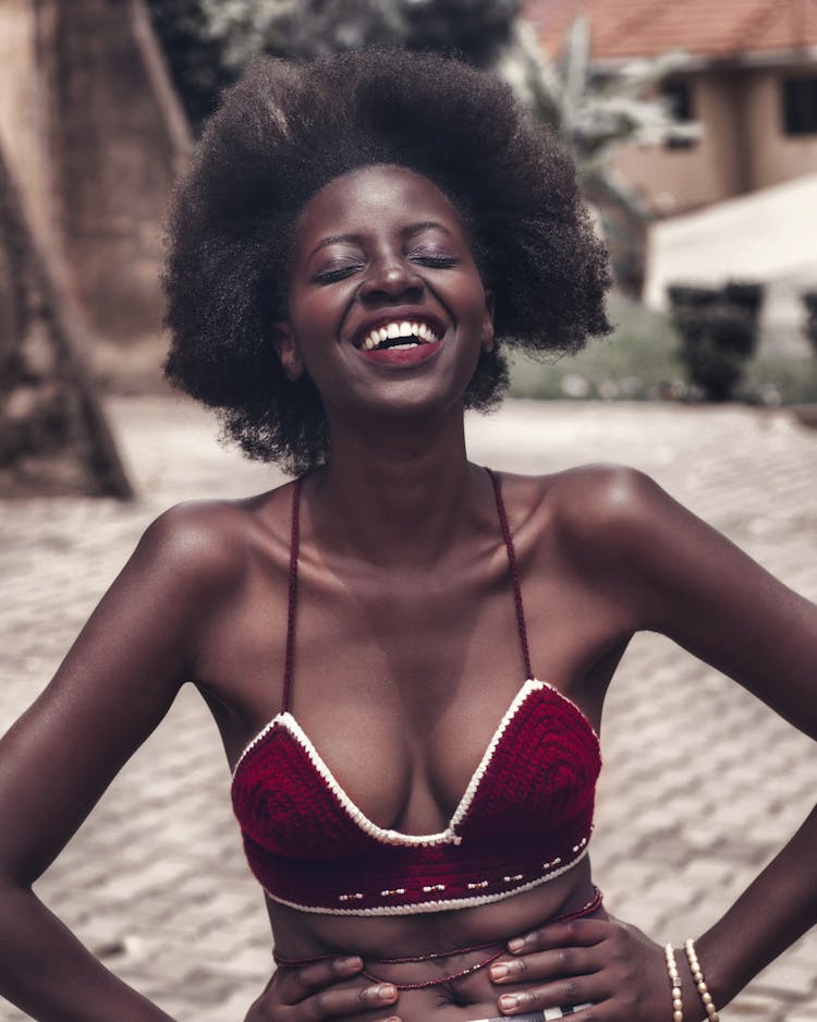 A Woman With Afro Hair Laughing