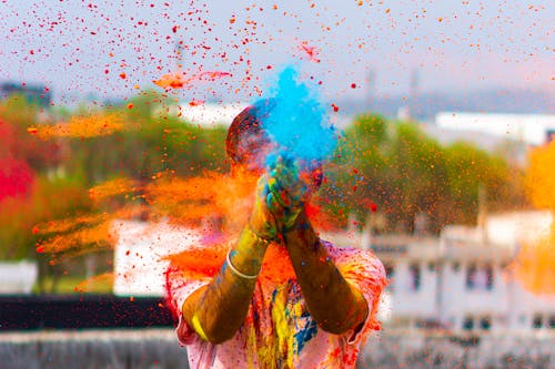 Person Holding Holi Powders