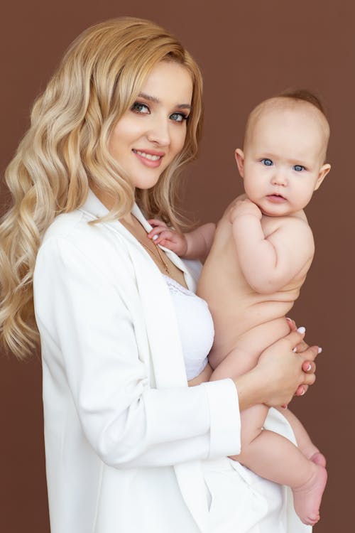 Smiling Woman Holding a Baby