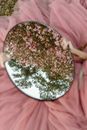 Person Holding an Oval Mirror