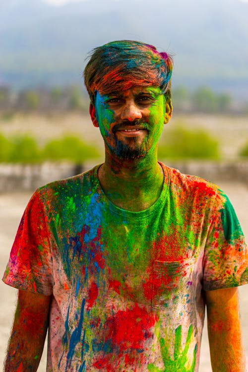 Man covered in Colorful Powders 