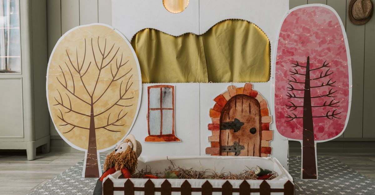 A cozy indoor puppet theater setup with hand-painted elements and whimsical decor.