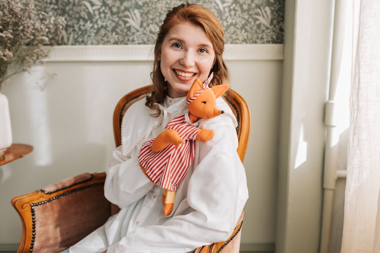 Smiling Woman Holding A Puppet