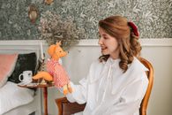 Woman Looking at a Hand Puppet