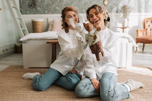 Smiling Women Playing Puppet Show