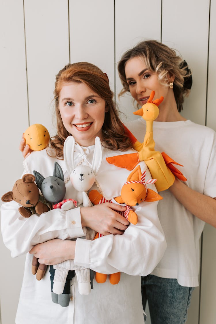 Women Holding Puppets