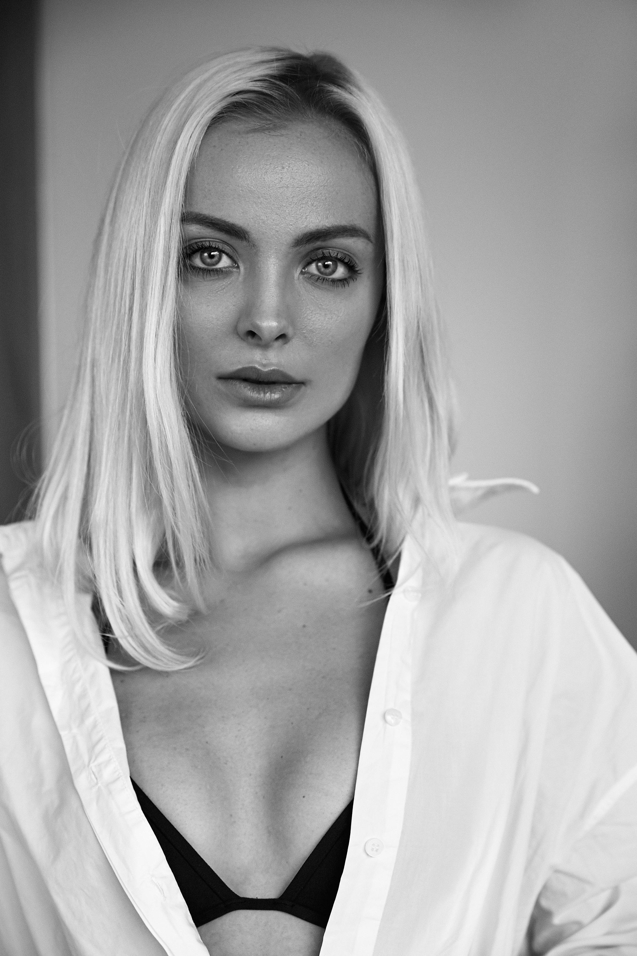 Striking black and white portrait of a model showcasing elegance and confidence.
