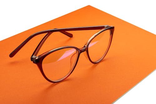 Darmowe zdjęcie z galerii z okulary do czytania, optyczny, pomarańczowa powierzchnia