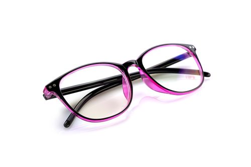Free Close-up of trendy pink and black eyeglasses with clear lenses on a white backdrop, ideal for eyewear and fashion themes. Stock Photo