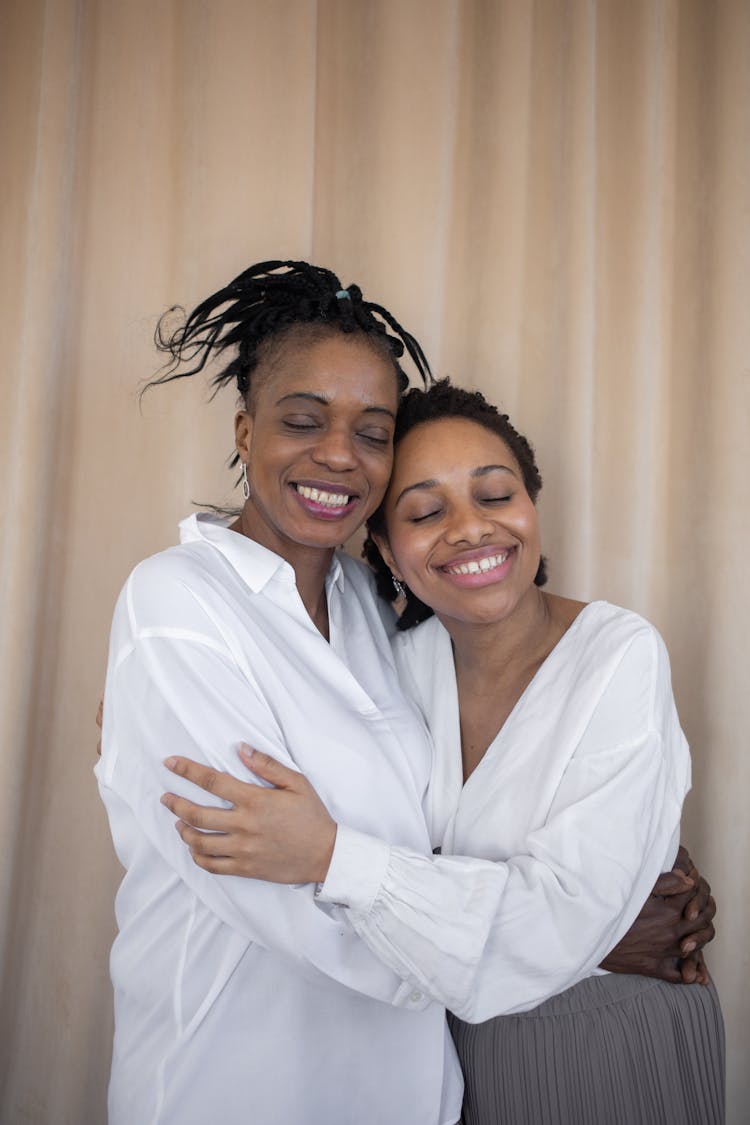 Mother And Daughter Hugging Each Other