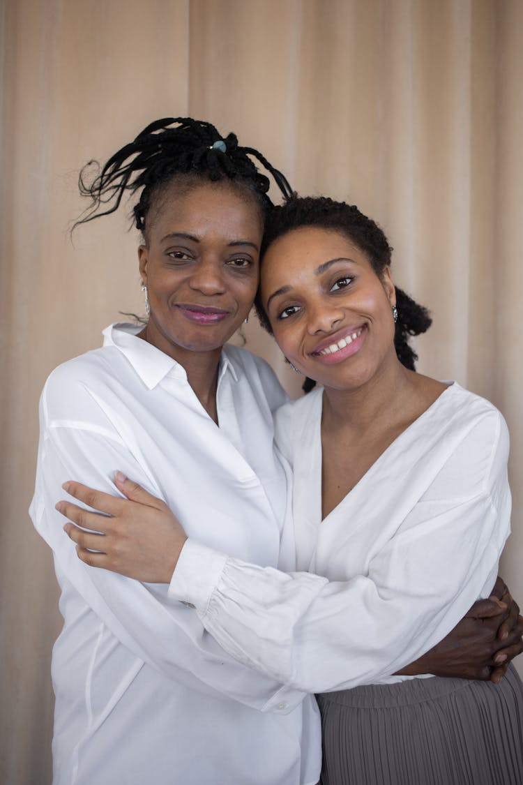 Mother And Daughter Hugging Each Other