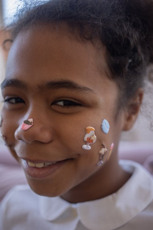Young Girl with Stickers on Face
