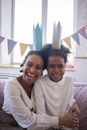 Mother and Daughter With Paper Craft Crowns on Their Head