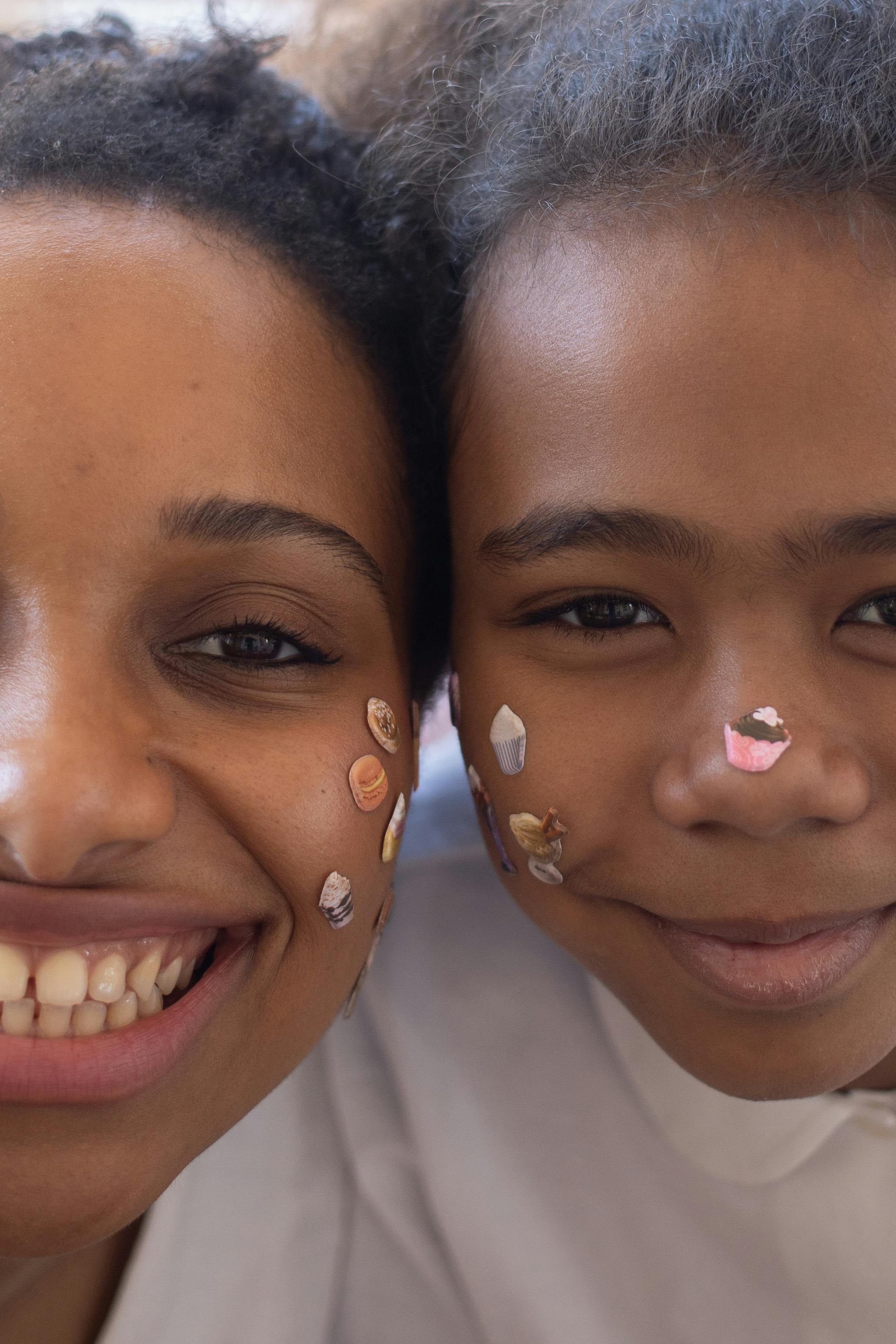 a close up shot of a mother and daughter