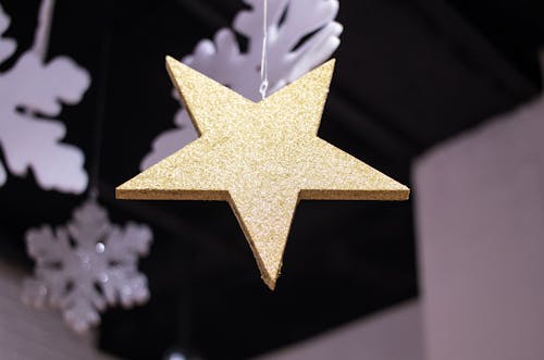 Close-up Photography of Star Covered with Glitters
