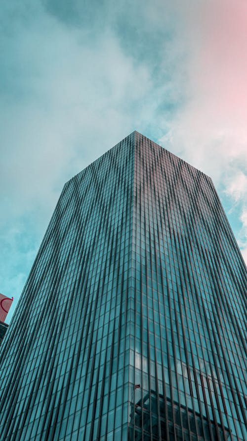 Free  Tall Building Under Cloudy Sky Stock Photo