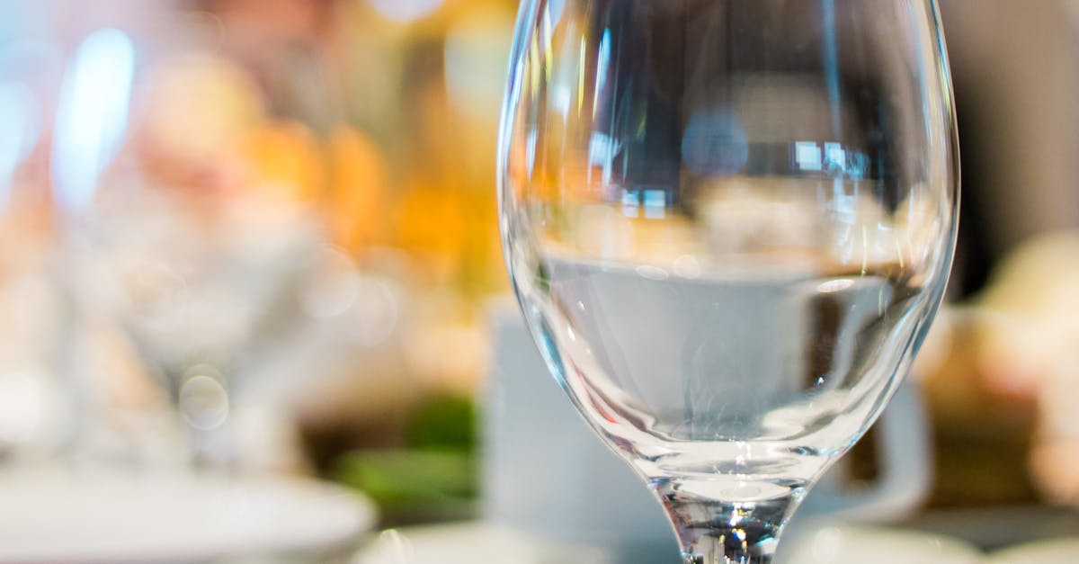 Selective Focus Photography of Clear Wine Glass