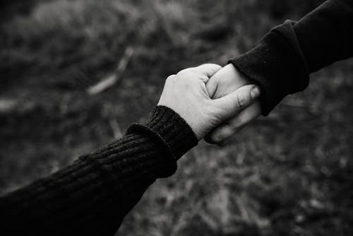 Free Black and White Photo of Holding Hands Stock Photo