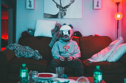 Free Boy in virtual reality helmet playing joystick Stock Photo