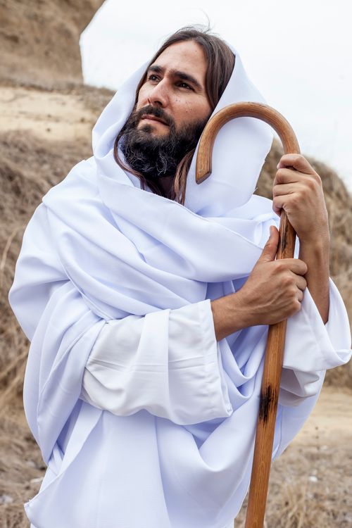 Shepherd In Robe A Man in White Robe Holding a Shepherd's Crook · Free Stock Photo