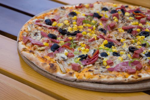 Pizza on Brown Wooden Tray