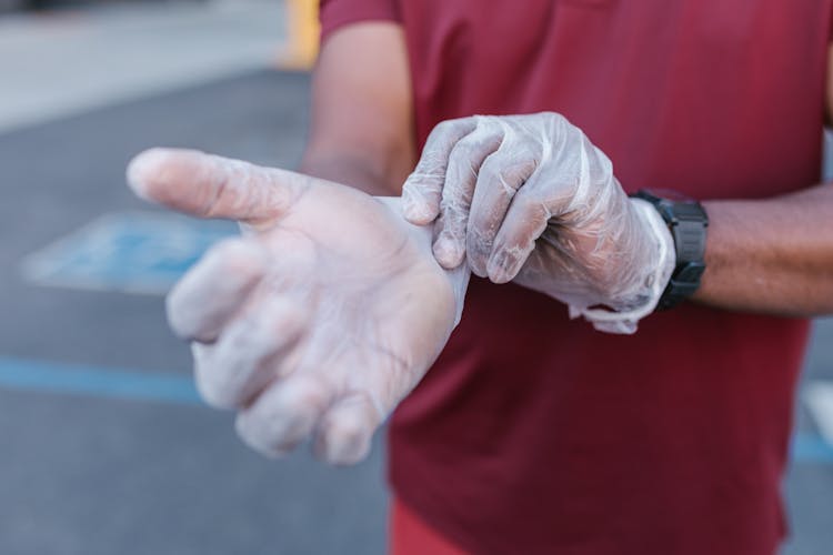 Person Putting On Gloves