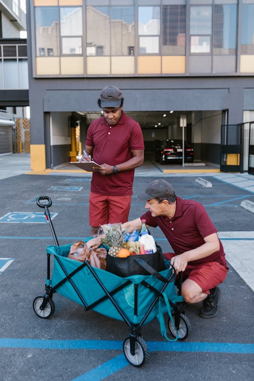 Deliverymen Checking on Grocery Deliveries