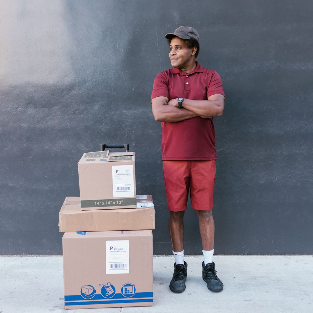 Downside — professional packers wrapping and boxing belongings