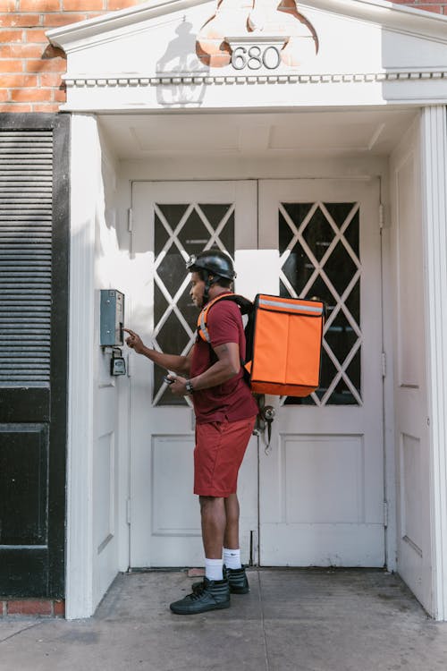 Delivery Person Standing on the Doorway