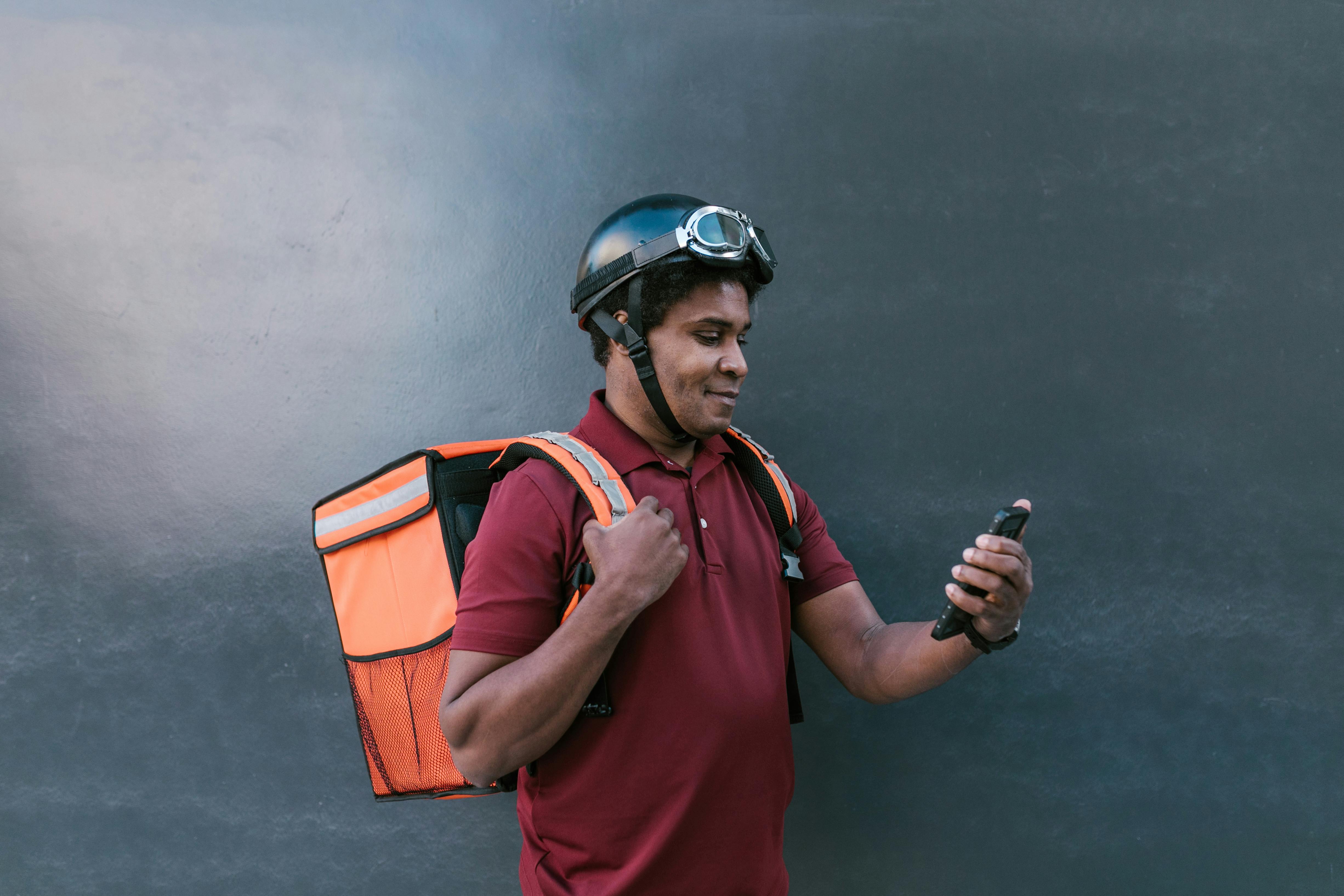 photo of a man looking at his cell phone