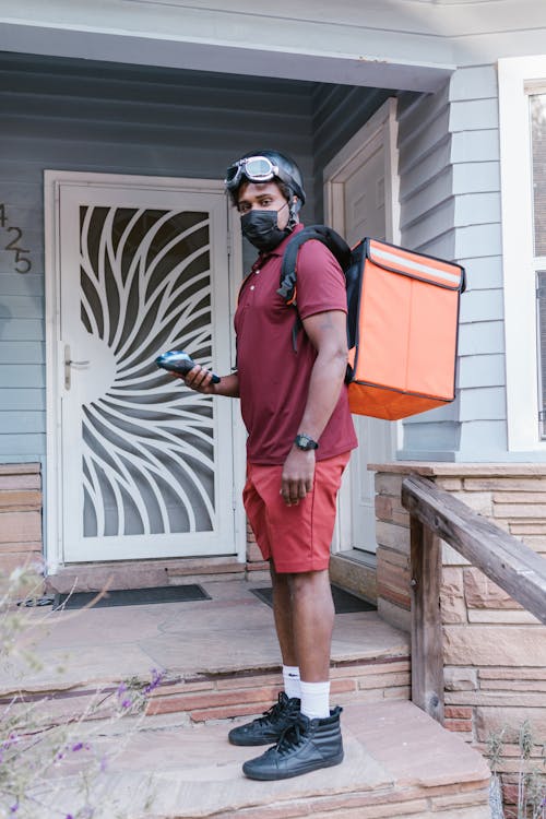 A Man Carrying a Delivery Bag