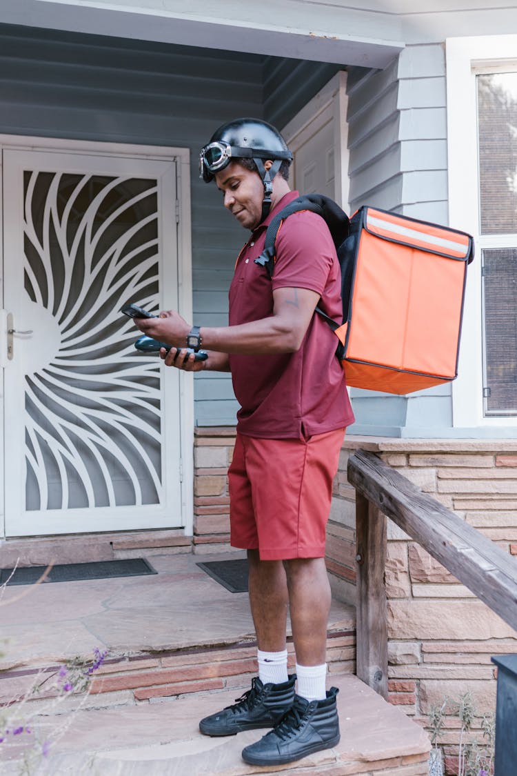 A Delivery Man On The Porch