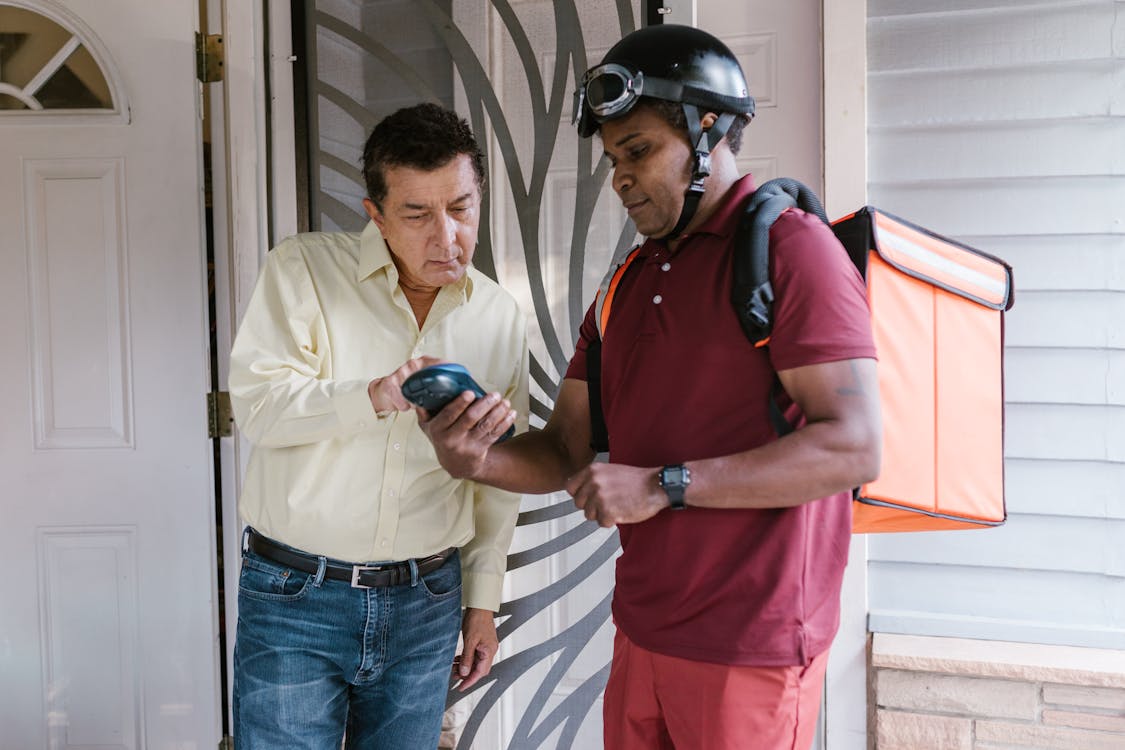 A Deliveryman in the Porch with the Recipient