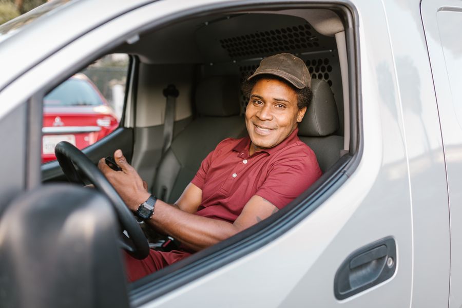 Professional driver smiling at the wheel