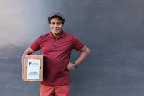 Man Carrying a Cardboard Box