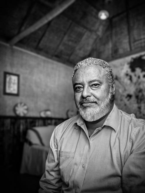 Free Black and white portrait of a mature man with facial hair in an indoor setting. Stock Photo