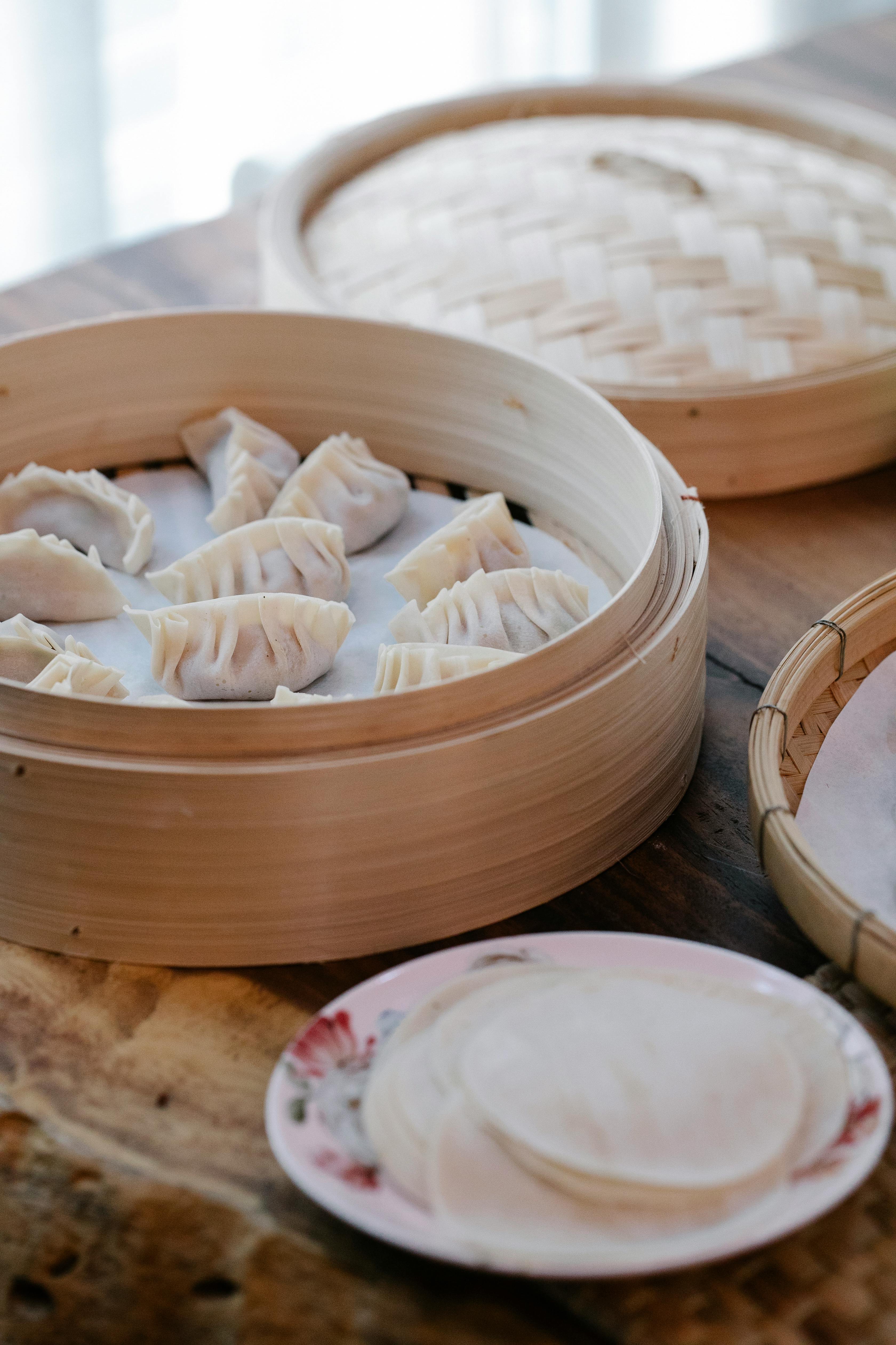 dim sum in bamboo steamer on table