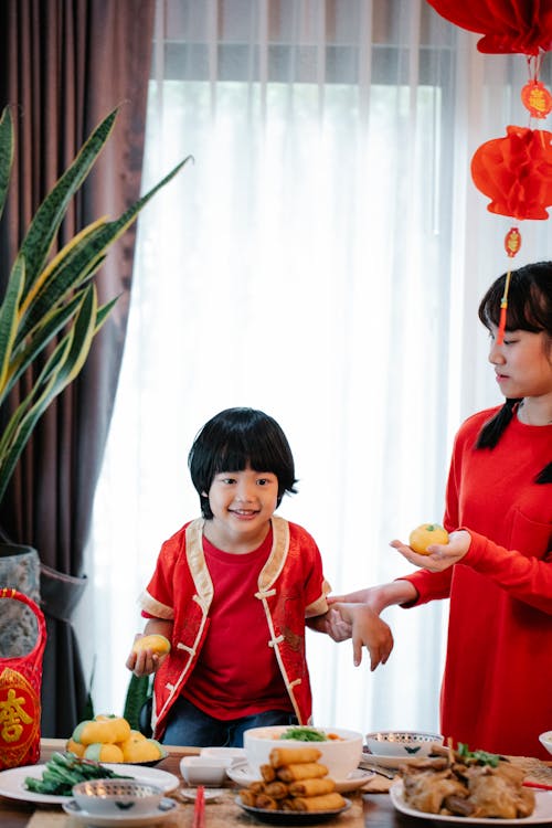 Siblings Wearing Red Clothes During the Lunar New Year