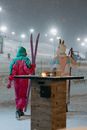 Person in Pink Jacket and Pants Holding Snow Shovel
