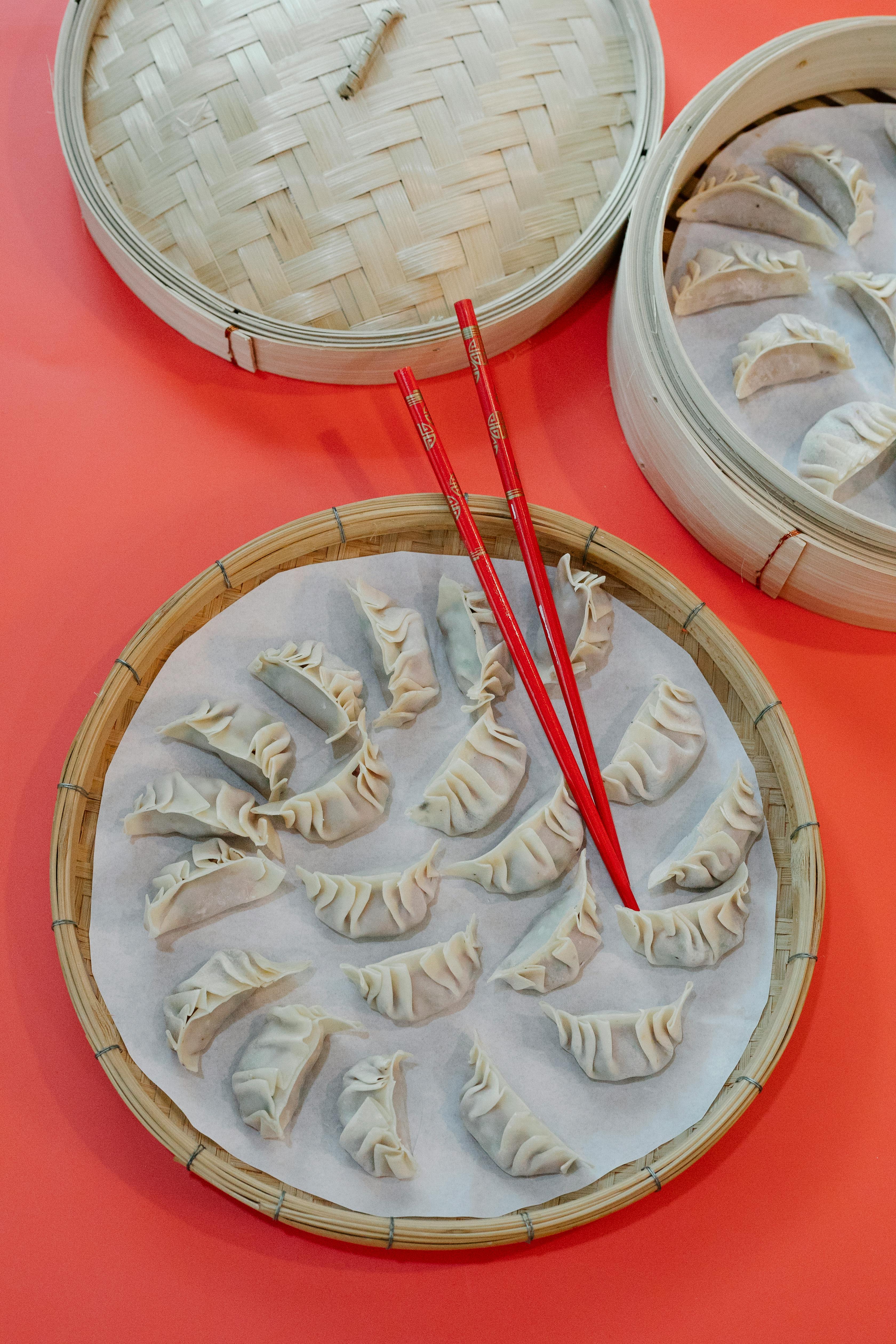 bamboo weave tray with raw dumplings