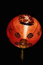 Bright lantern burning on dark sky
