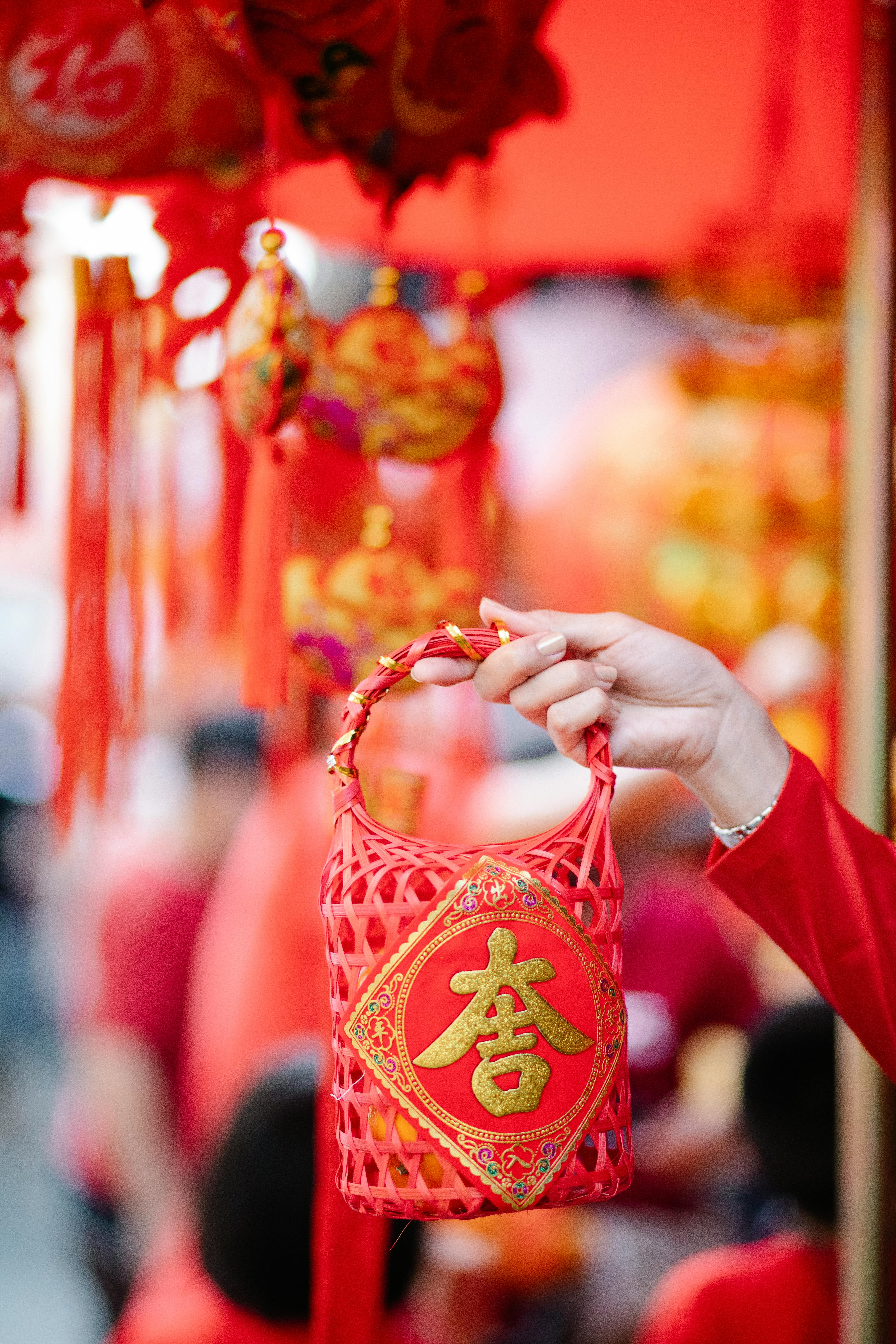 a woman holding a red basket